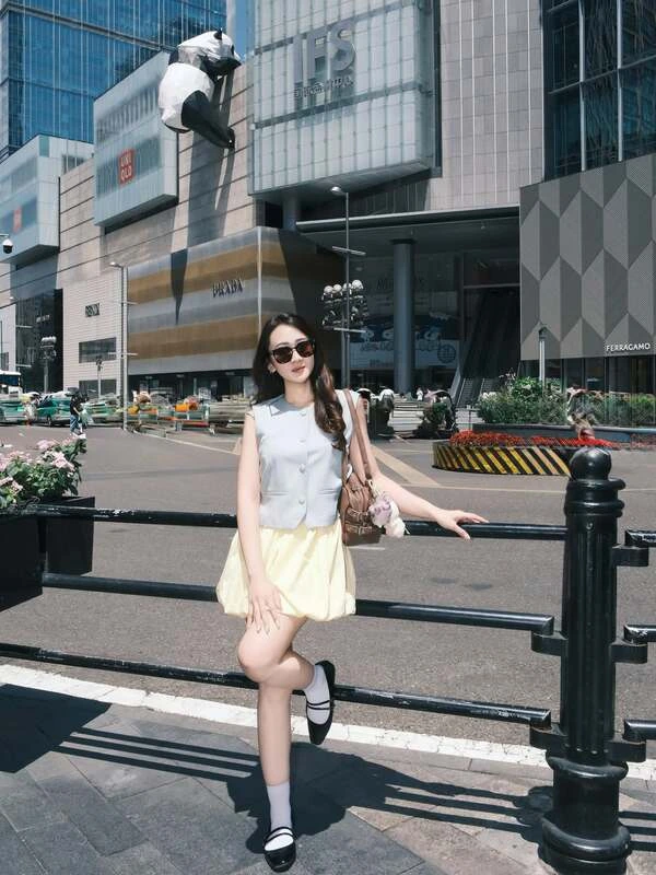 Grey Vest And Yellow Skirt