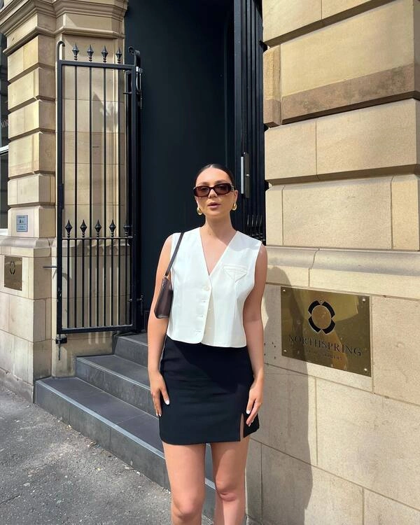 White Vest and Black Mini Skirt